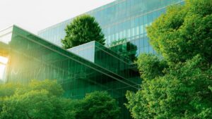 energy efficient office building with green roofs and trees around it
