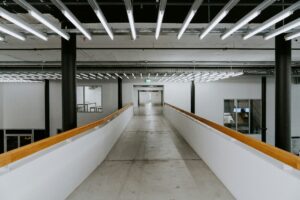 multiple linear fixtures in a commercial building with fluorescent bulbs